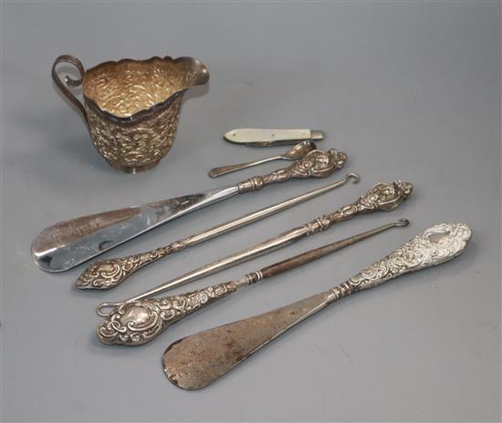 An Indian? white metal cream jug and other silver including salt spoon, fruit knife, button hooks, etc.